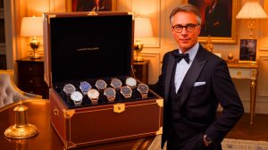 Illustration de Laurent Blanc admirant une montre de luxe dans sa collection privée. Image réalisée par IA.